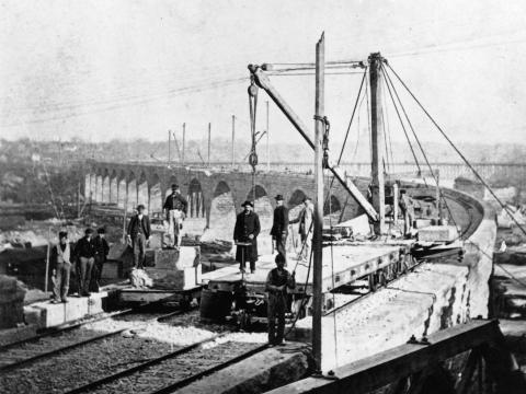 The Stone Arch Bridge deck being completed in 1883. (Burlington Northern, Minnesota Historical Society)