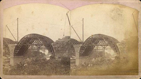 This stereoscope image shows the stone arches being built over forms in 1883. (Henry Farr, Minneapolis Historical Society)